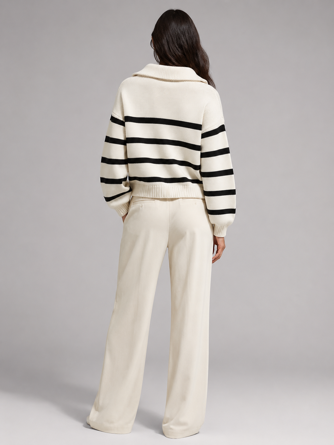 White and Black striped knit half-zip sweater worn by a female model, back view