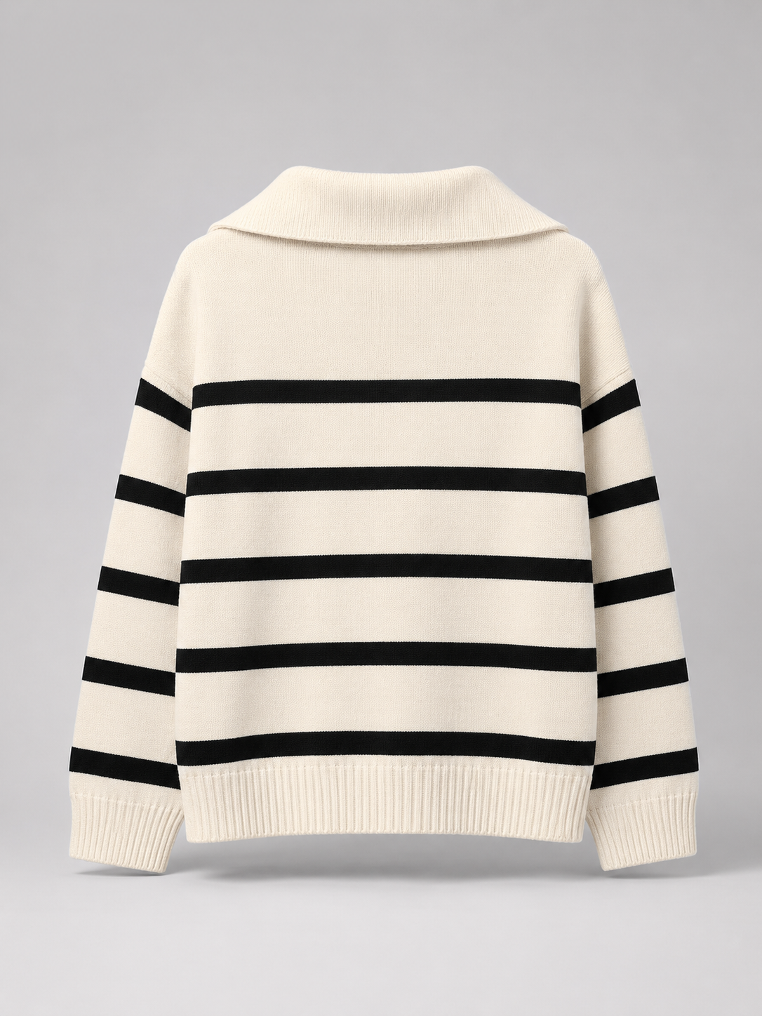 White and Black striped knit half-zip sweater shown flat from the back