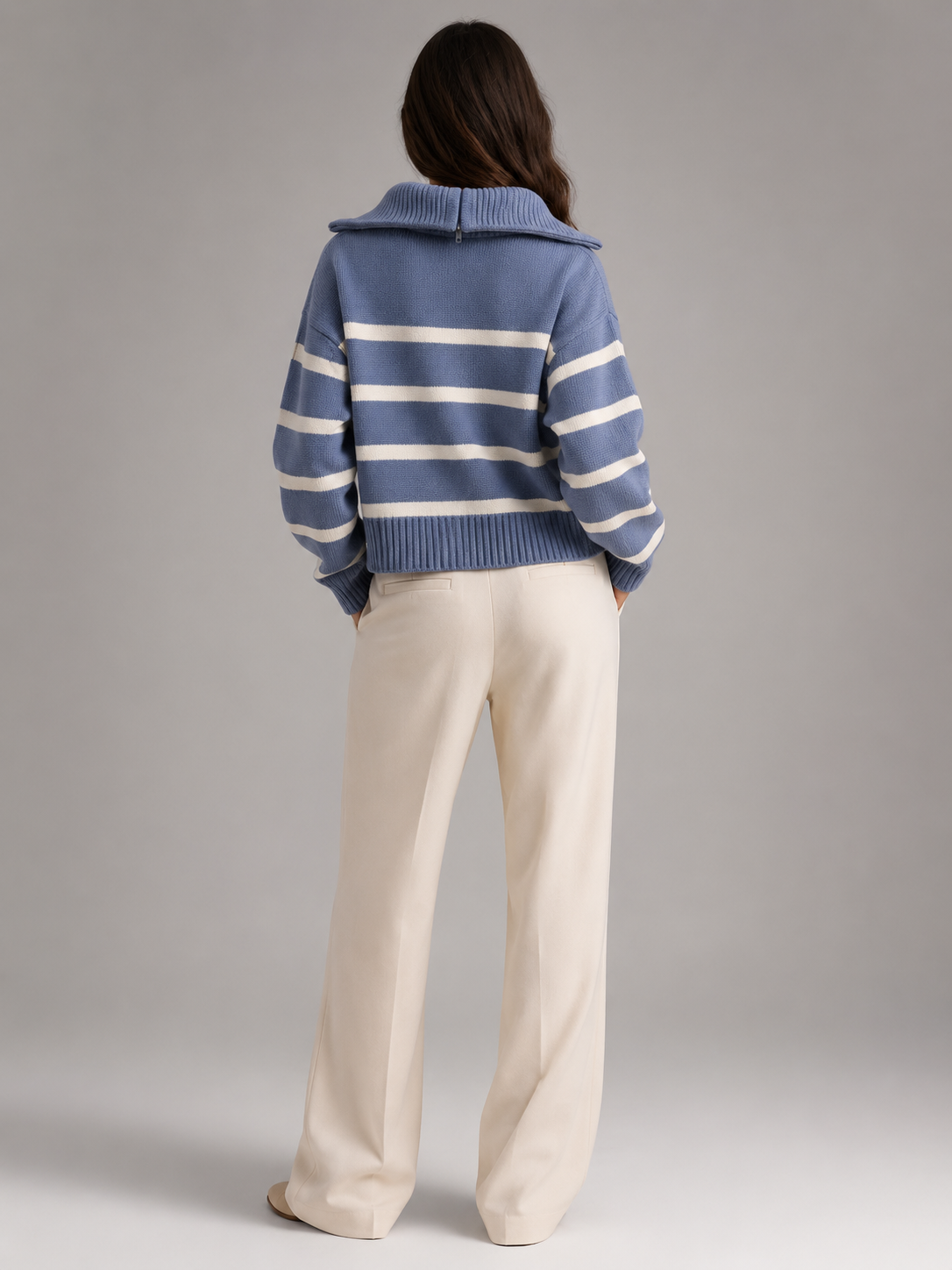 Blue and White striped knit half-zip sweater worn by a female model, back view