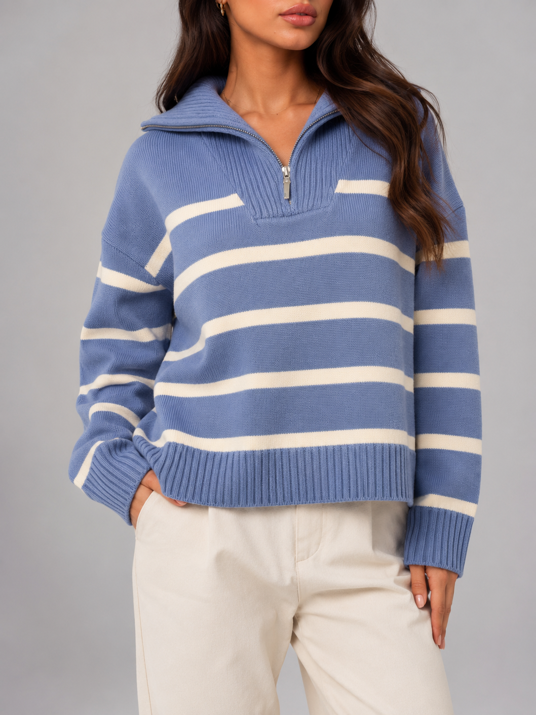 Blue and White striped knit half-zip sweater worn by a female model, front view