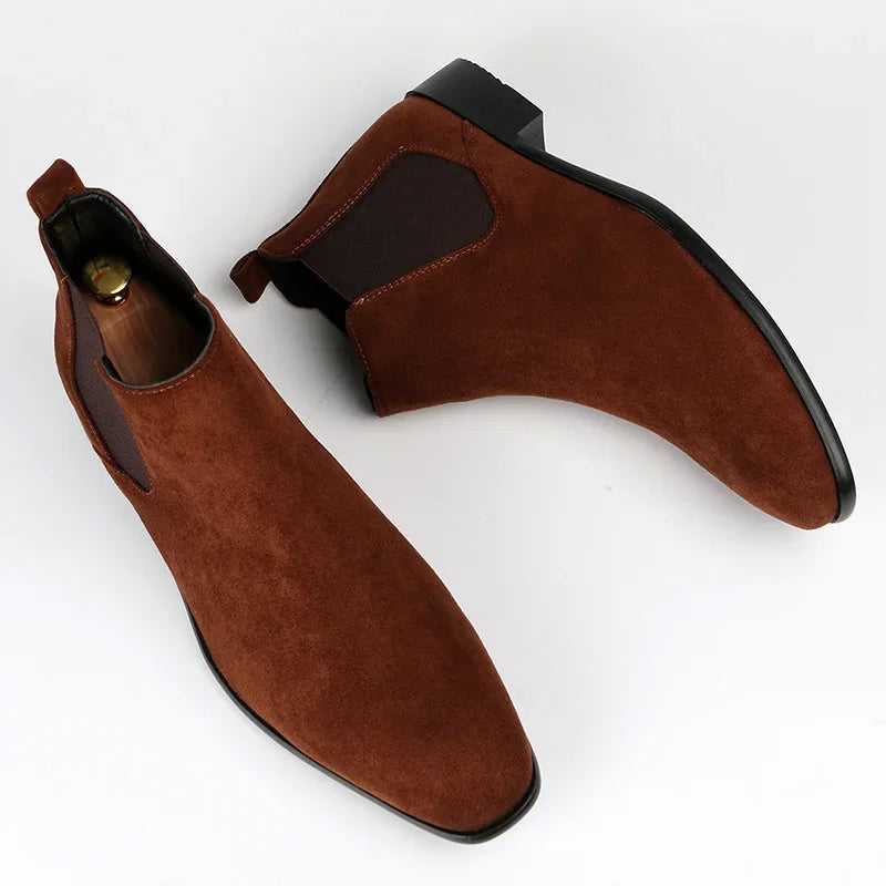 Brown suede Chelsea boots with a square toe, elastic side gussets, back pull tabs, and a low black block heel.
