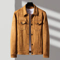 A tan suede jacket for men with a tailored fit, button front, and two chest flap pockets, shown on a hanger