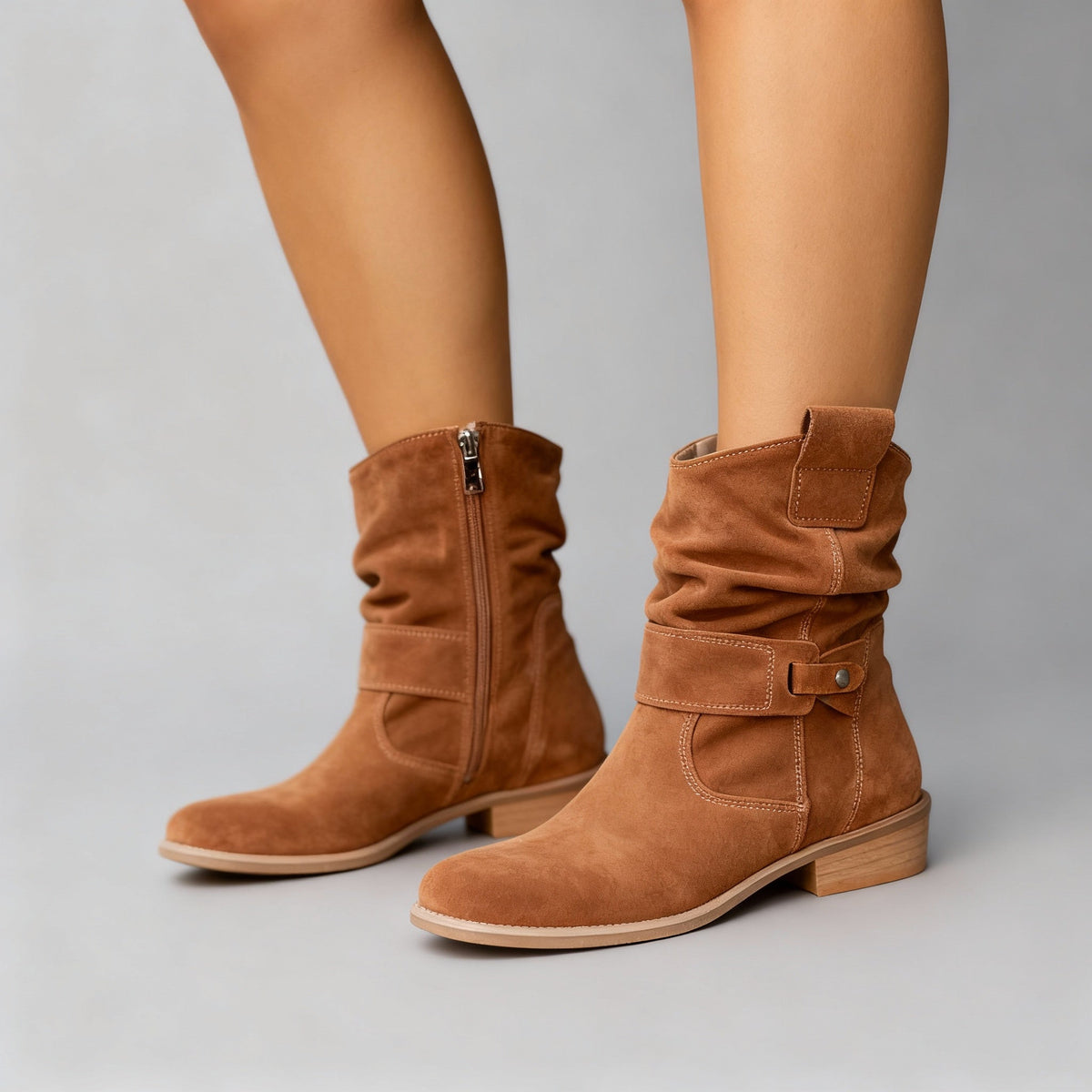 Brown suede slouchy ankle boots with low block heels.