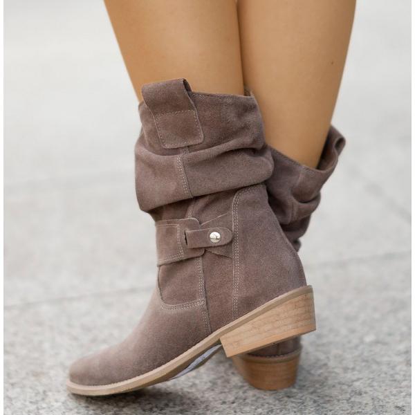 Taupe suede slouchy ankle boots with buckle details and low heels.