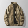 A taupe suede moto jacket for men with a distressed finish, zip front, high collar, and zippered pockets