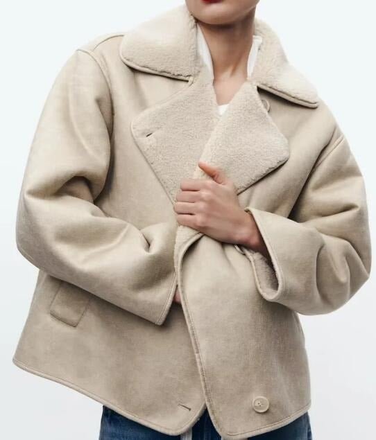 Beige suede shearling jacket for women with a boxy fit, plush collar, and aviator style