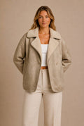 Beige suede shearling jacket for women with a boxy fit, plush lining, wide collar, and aviator style