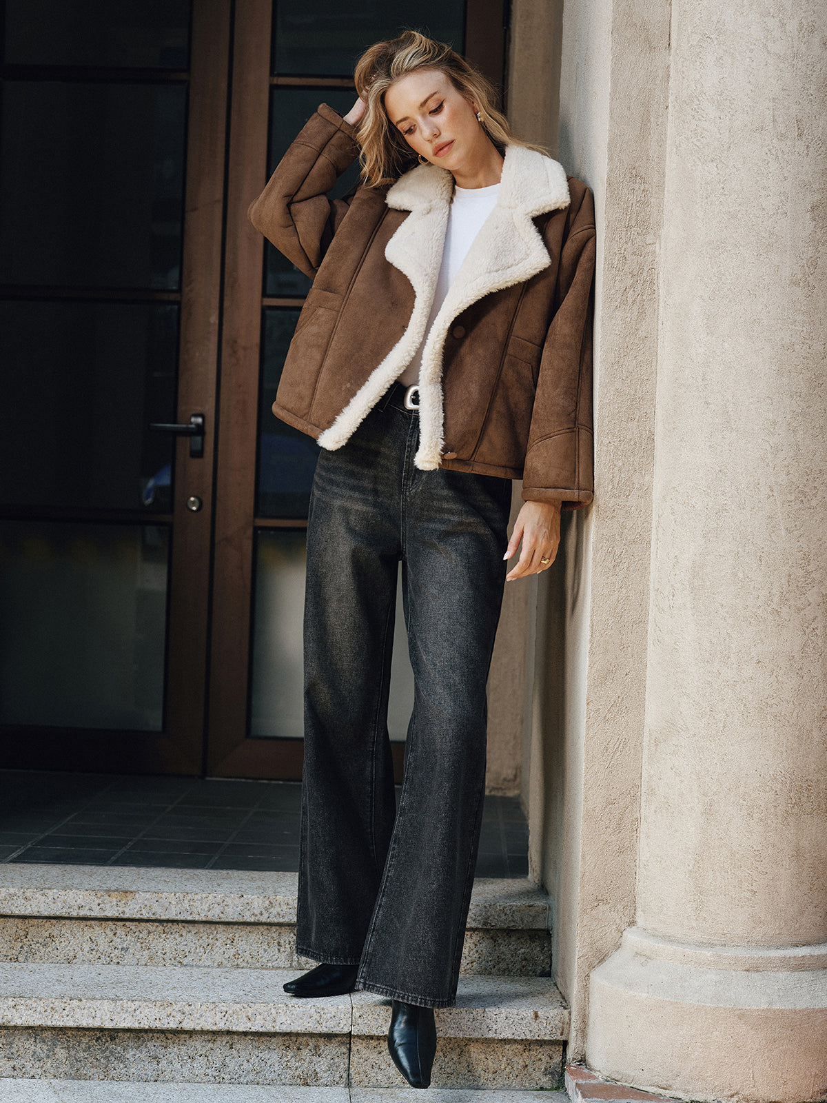 Brown thickened wool shearling jacket worn by a female model, full-body view with a boxy fit and plush collar