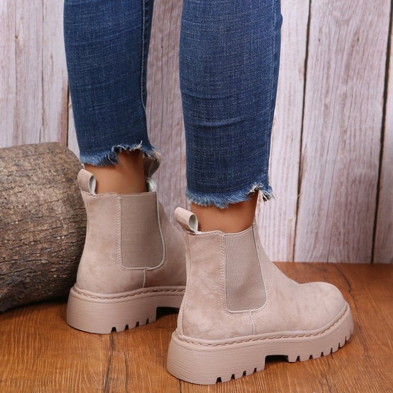 Beige vegan leather Chelsea ankle boots for women with elastic side panels and platform sole, back view