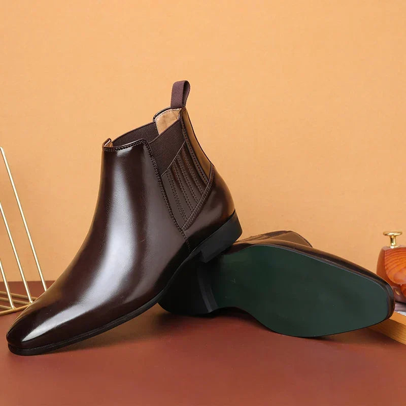Dark brown vegan leather Chelsea ankle boots for men shown front-on, highlighting the tapered pointed toe
