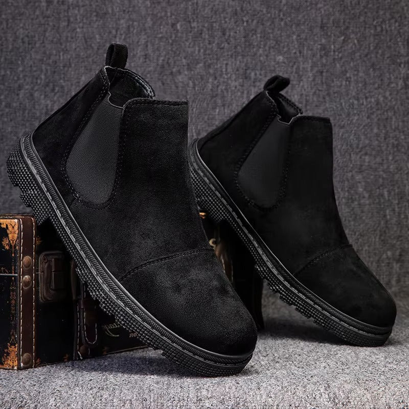 Pair of black vegan suede Chelsea boots for men with rear pull tabs and deep lug sole