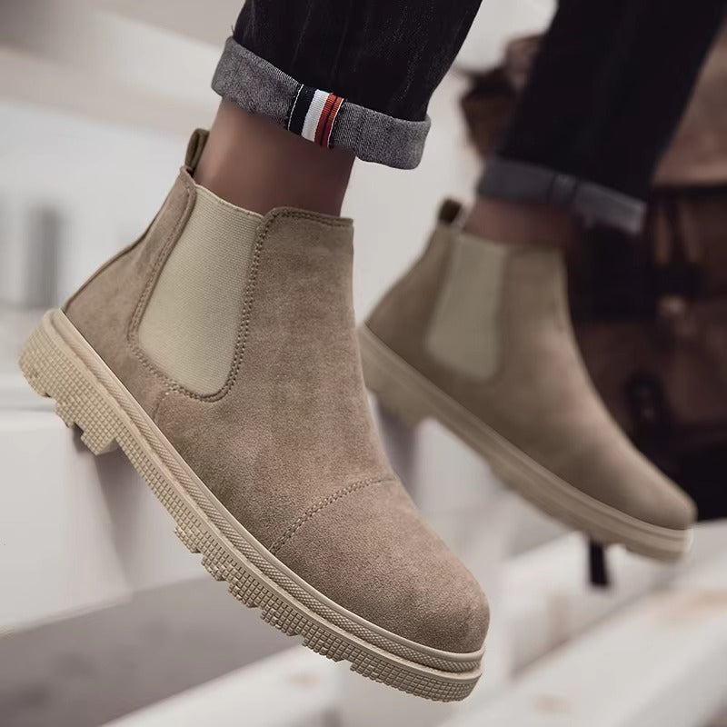 Beige vegan suede Chelsea boots for men with cream lug sole, worn with cuffed black jeans