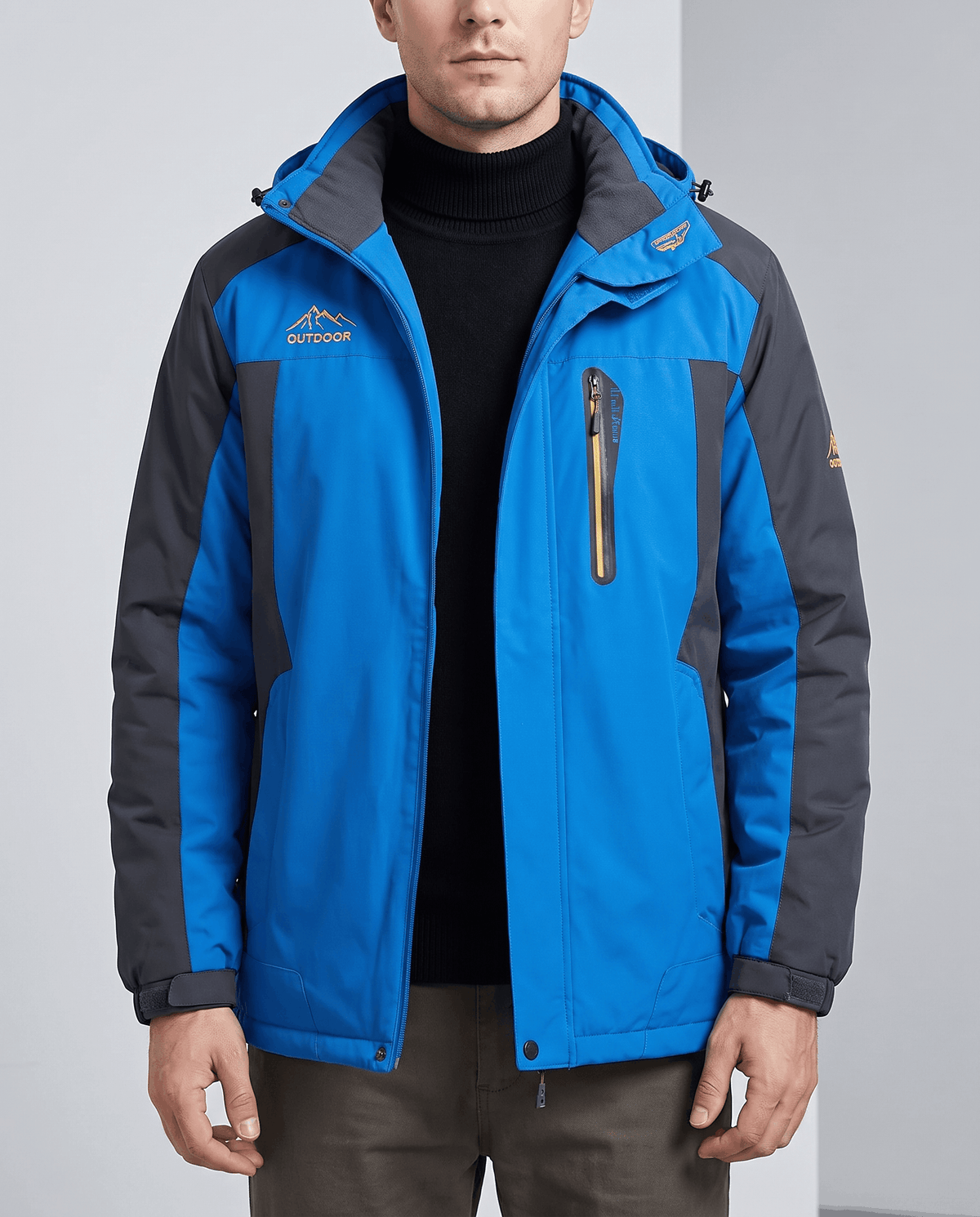 Blue water-repellent hooded winter parka worn by a male model
