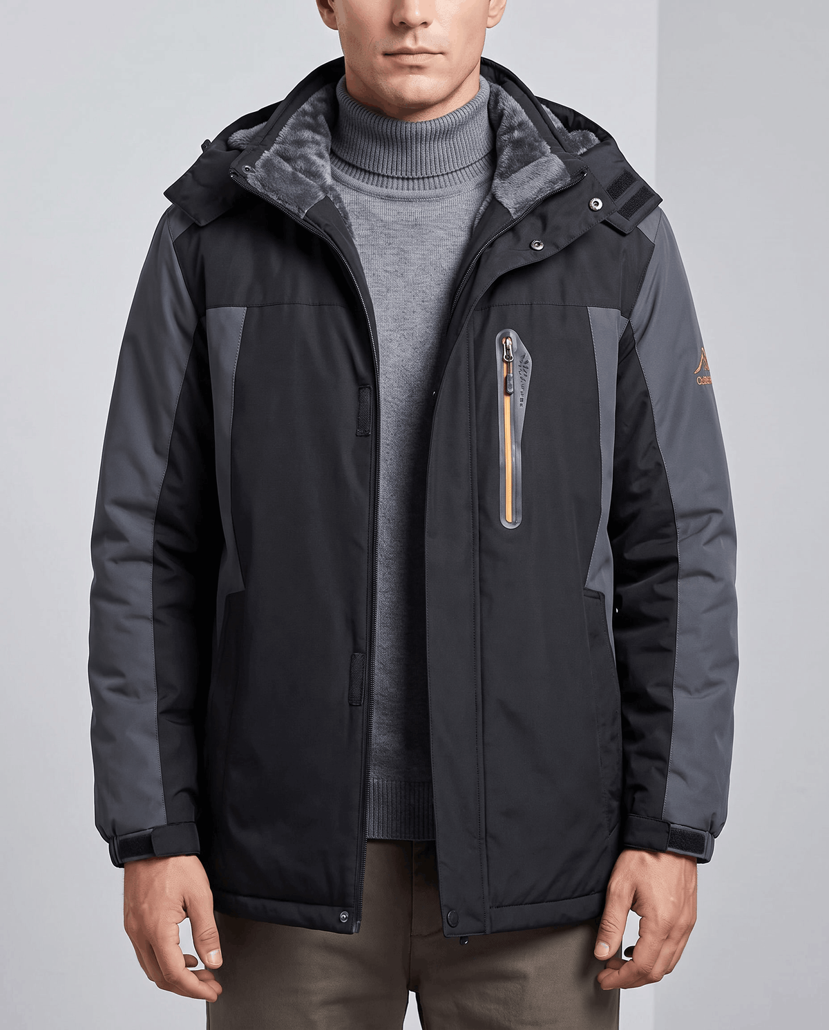 Black and gray water-repellent hooded winter parka worn by a male model