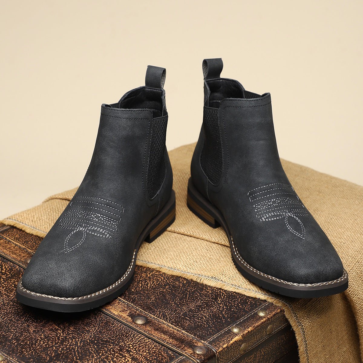 Front view of black wide fit Chelsea boots for men showing the wide square toe box and stitched sole