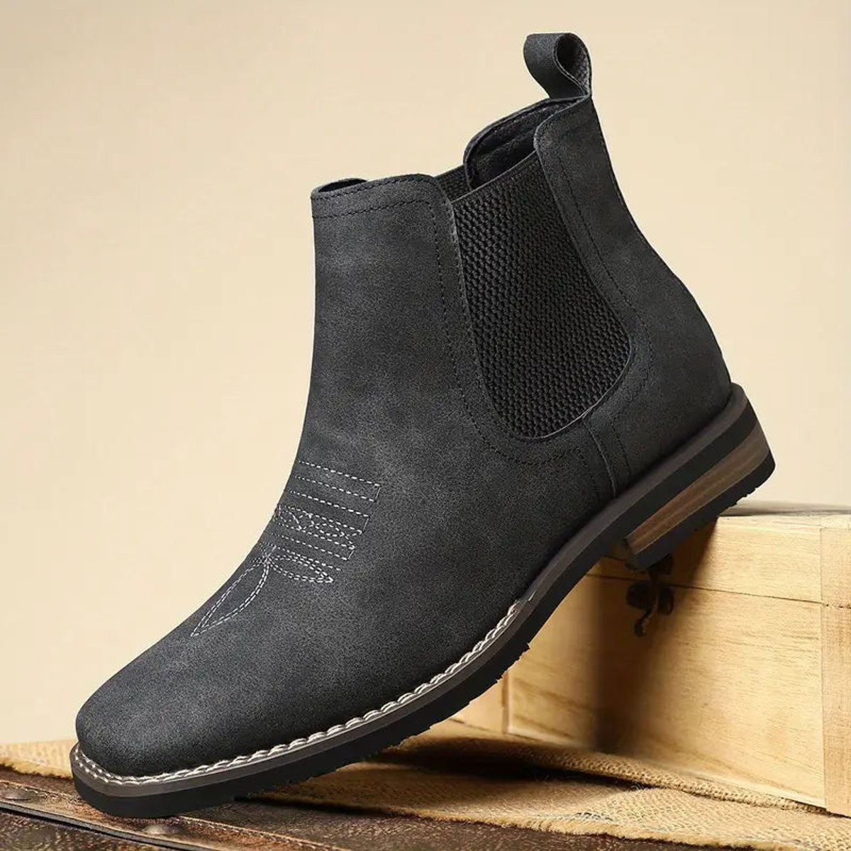 Dark gray wide fit Chelsea boot for men shown at an angle, with mesh elastic side panel and rear pull tab