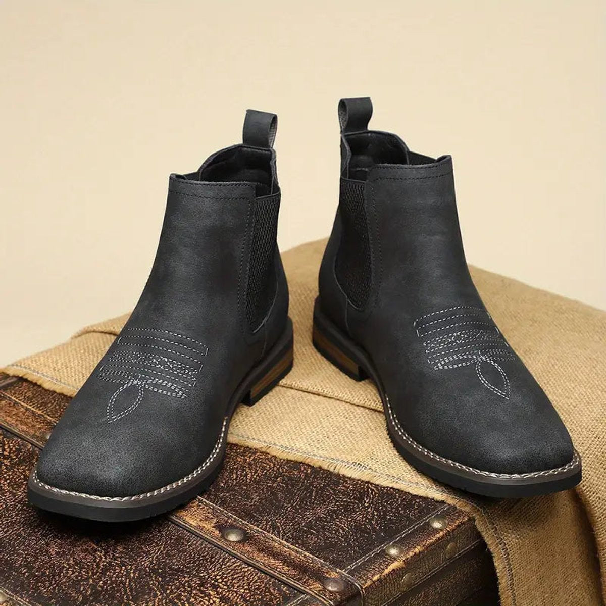 Black wide toe box Chelsea boots for men displayed as a pair, showing the roomy square toe and stacked heel