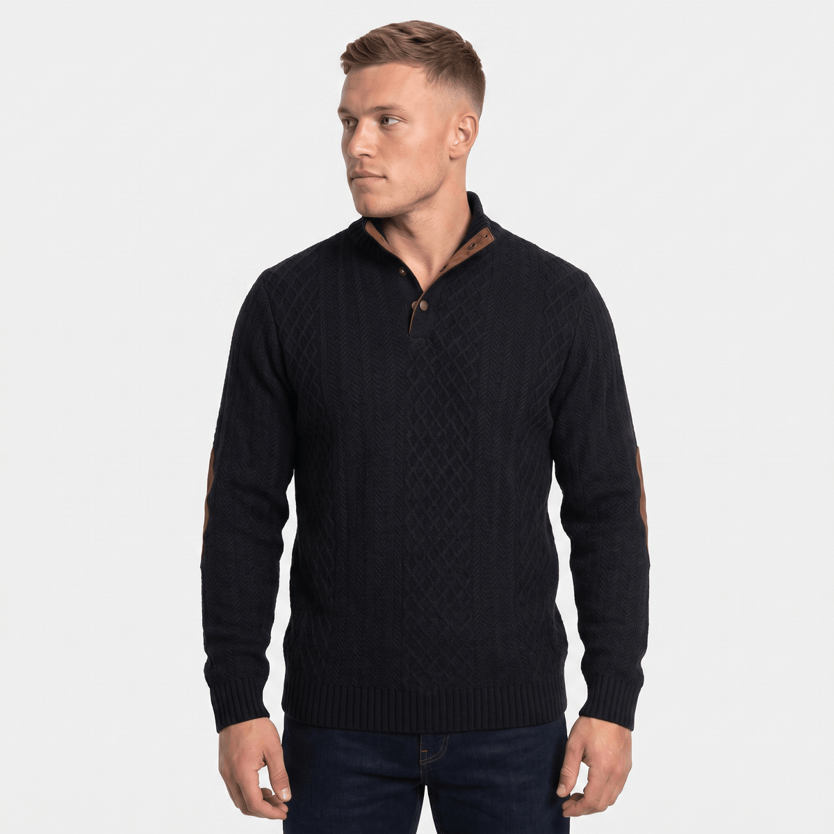 Man wearing a black cable knit Henley sweater with a stand collar, button placket, faux suede collar trim and elbow patches, long sleeves, and a classic fit.