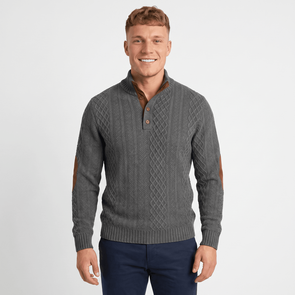 Side view of a man wearing a gray cable knit Henley sweater featuring a stand collar and elbow patch details.