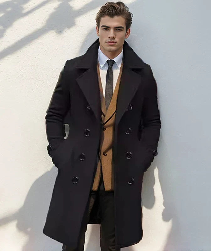A man wearing a black wool blend double-breasted trench coat with a tailored fit and wide lapel
